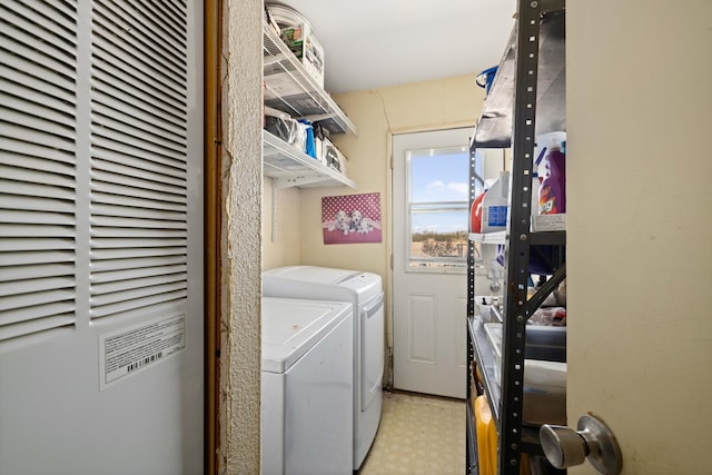 laundry area with washing machine and dryer