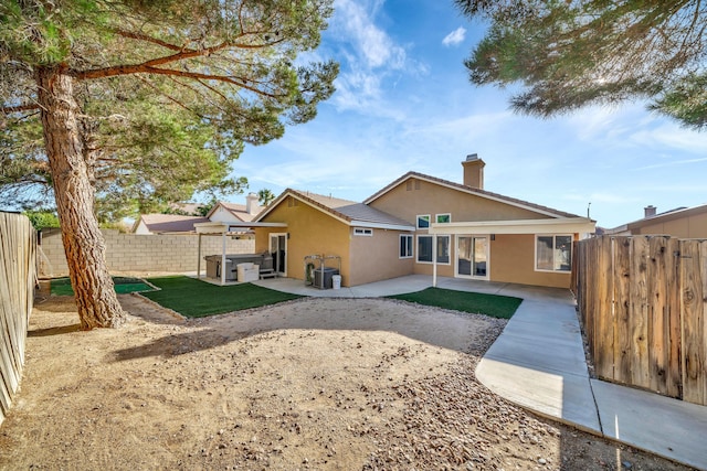 rear view of house with a patio