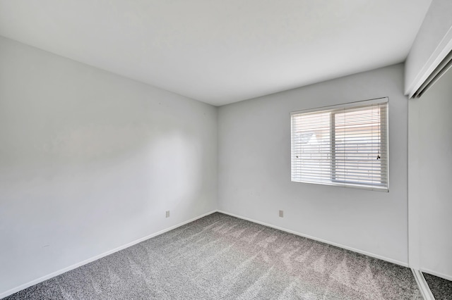 unfurnished room with carpet floors