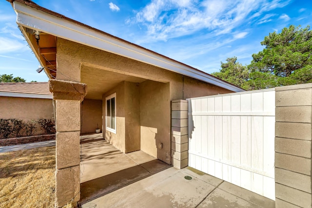 view of side of home featuring a patio