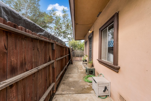 view of side of home featuring a patio area