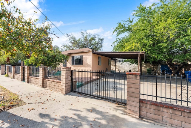 view of gate with a carport