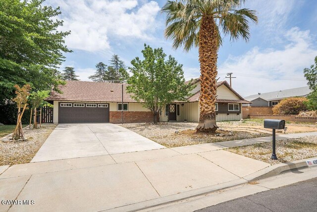 43818 Halcom Ave, Lancaster, CA 93536 - ranch-style house with a garage, driveway, and a tile roof