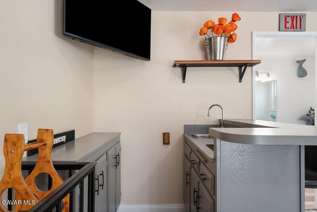 43818 Halcom Ave, Lancaster, CA 93536 - laundry room with a sink and baseboards