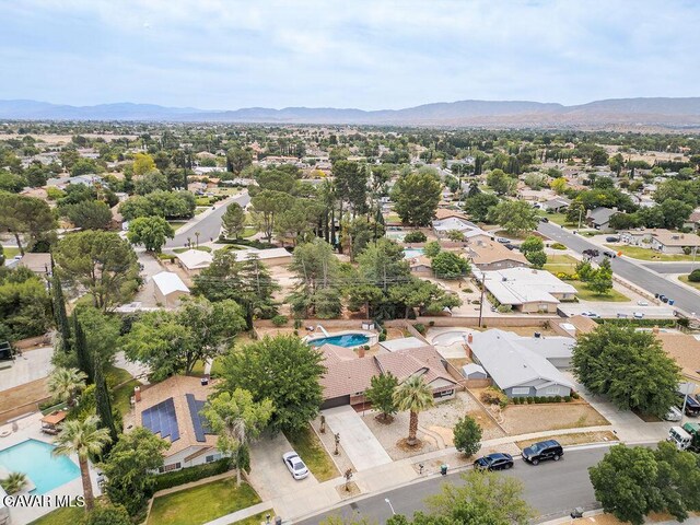 43818 Halcom Ave, Lancaster, CA 93536 - aerial perspective of suburban area featuring a pool and a mountainous background