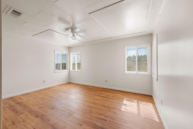 unfurnished room with ceiling fan and light hardwood / wood-style floors