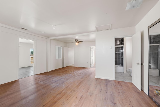 spare room featuring ceiling fan and light hardwood / wood-style floors