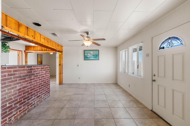 entrance foyer featuring ceiling fan and light tile patterned flooring