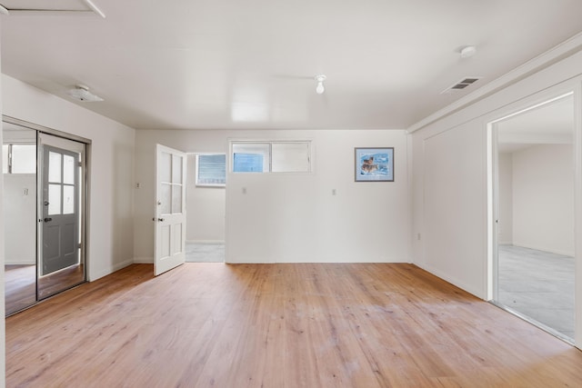 unfurnished room featuring light hardwood / wood-style floors