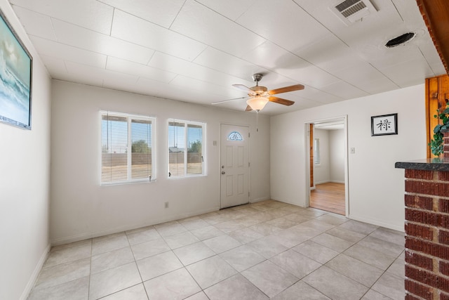 entrance foyer featuring ceiling fan and light tile patterned floors