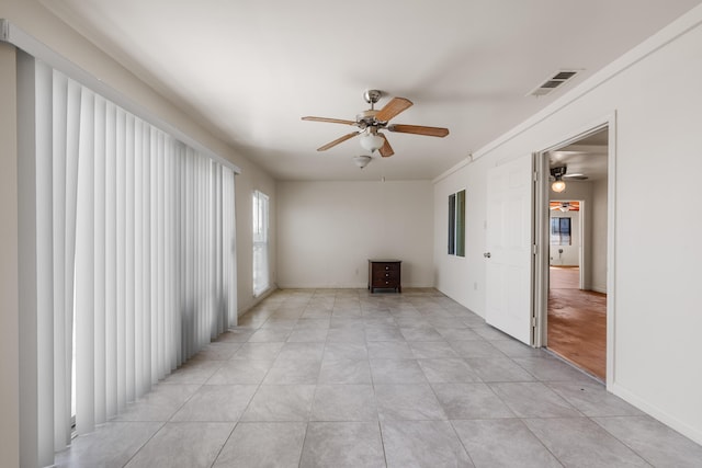 spare room featuring light tile patterned flooring