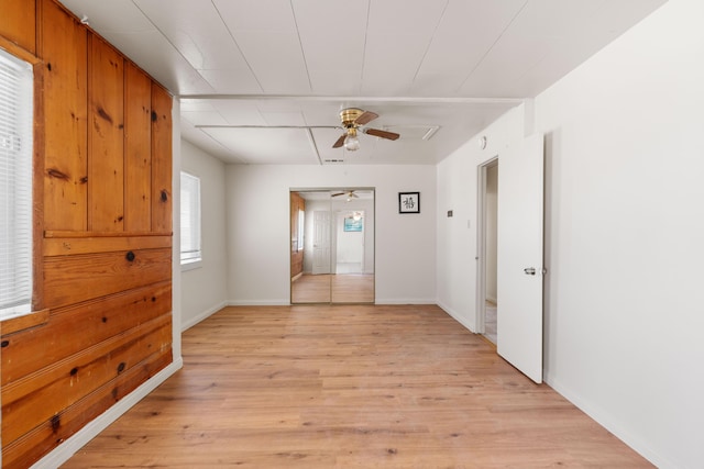 unfurnished room featuring light hardwood / wood-style floors and ceiling fan