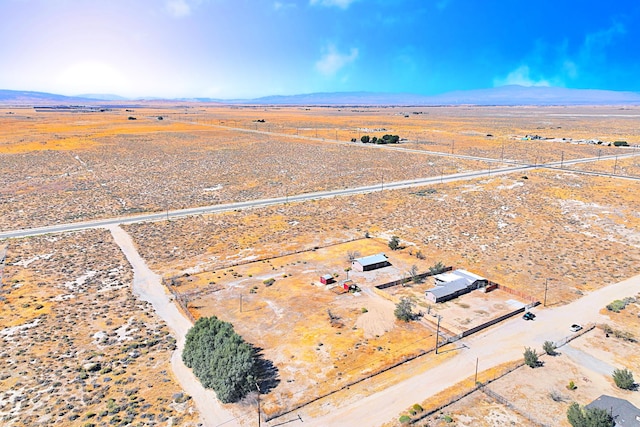 birds eye view of property with a rural view