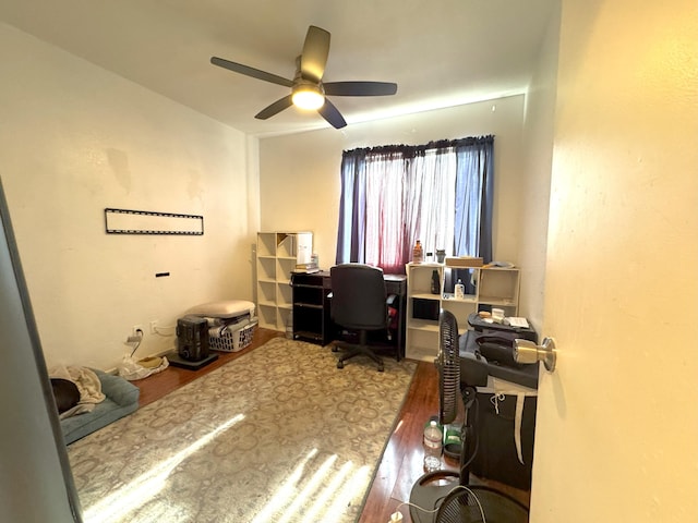 home office featuring hardwood / wood-style floors and ceiling fan