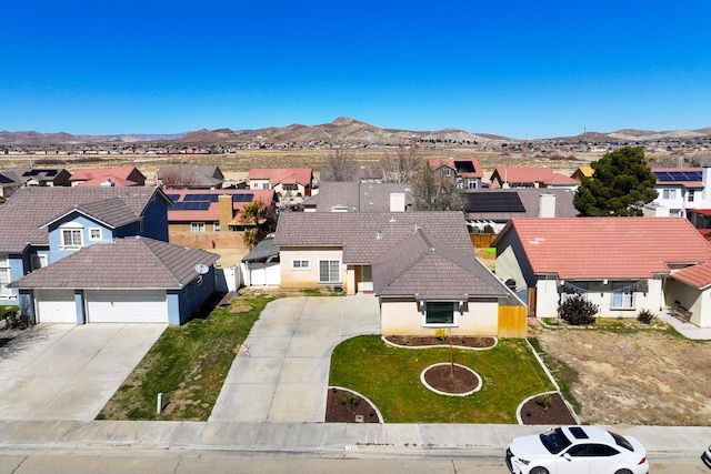 aerial view featuring a mountain view and a residential view