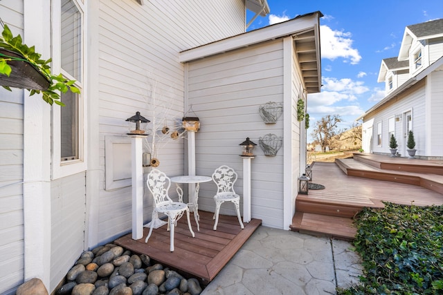 property entrance with a deck