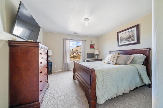 bedroom featuring light carpet