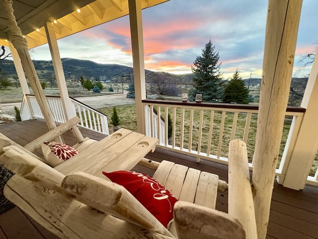 deck at dusk with a mountain view