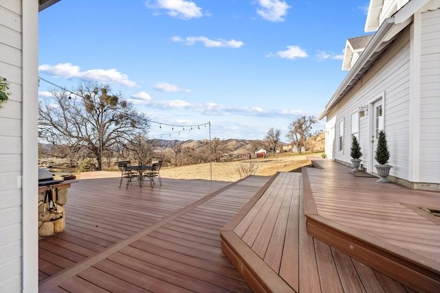 wooden terrace with a mountain view