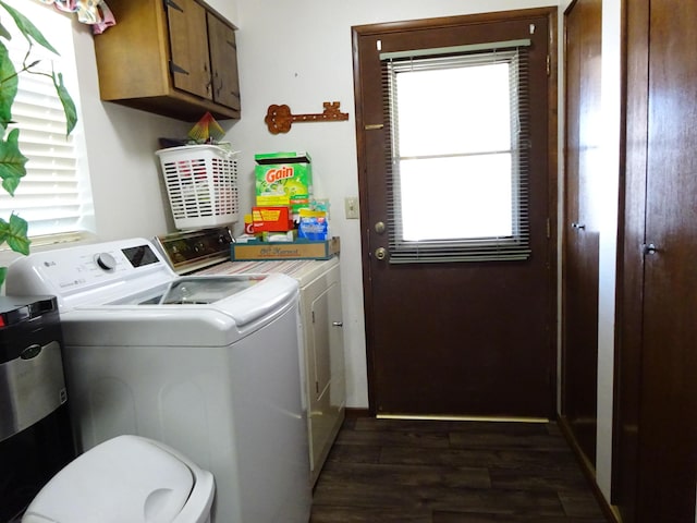 laundry area featuring cabinet space, dark wood-style flooring, and washer and dryer