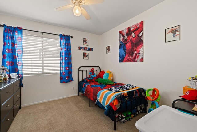 bedroom with baseboards, carpet flooring, and a ceiling fan