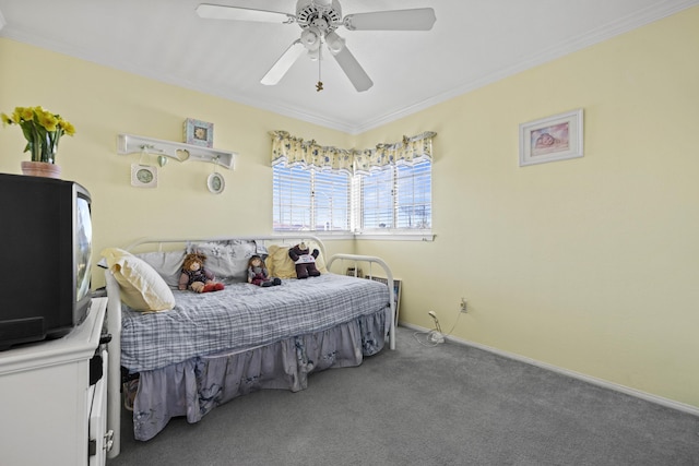 bedroom with carpet floors, ceiling fan, and crown molding