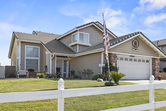 view of front of home featuring a front yard and a garage