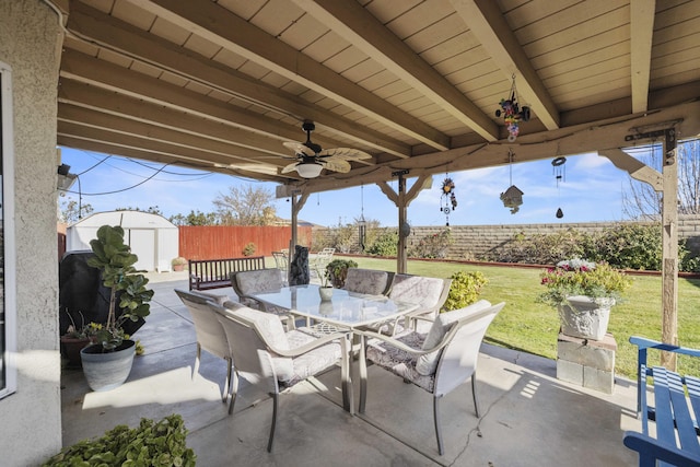 view of patio with a storage unit and ceiling fan