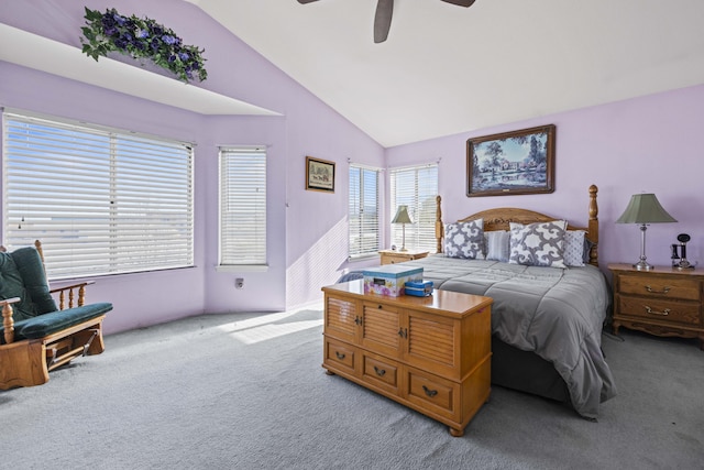 bedroom with light colored carpet, vaulted ceiling, and ceiling fan