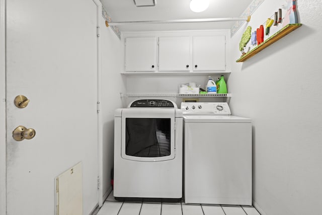 laundry area with cabinets and independent washer and dryer