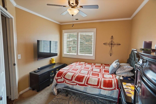 carpeted bedroom with ceiling fan and ornamental molding