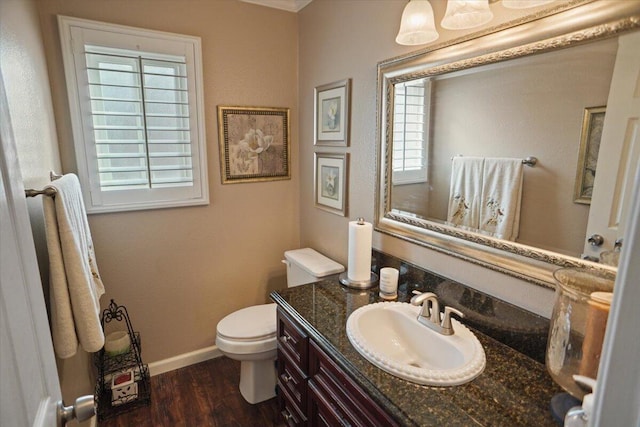 bathroom featuring vanity, hardwood / wood-style floors, and toilet