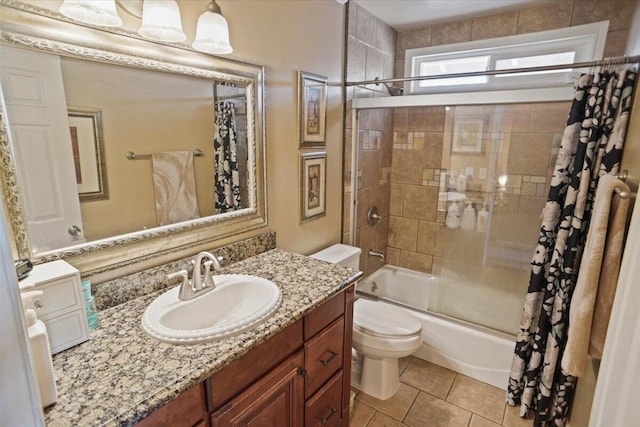 full bathroom featuring shower / tub combo with curtain, vanity, toilet, and tile patterned floors