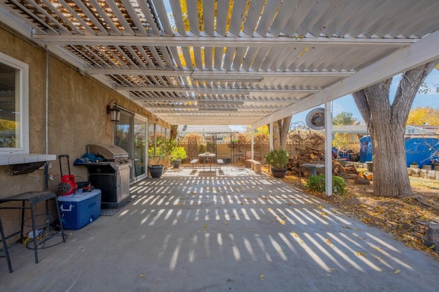 view of patio featuring a pergola and grilling area