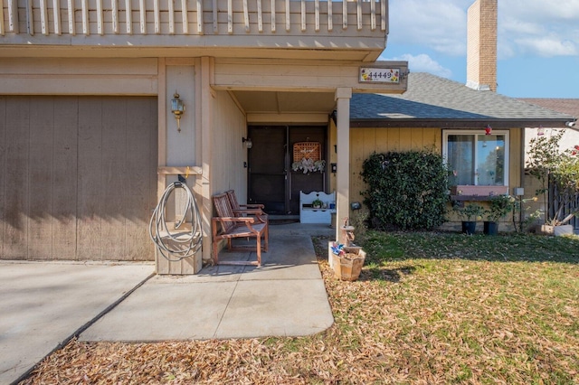 property entrance with a lawn