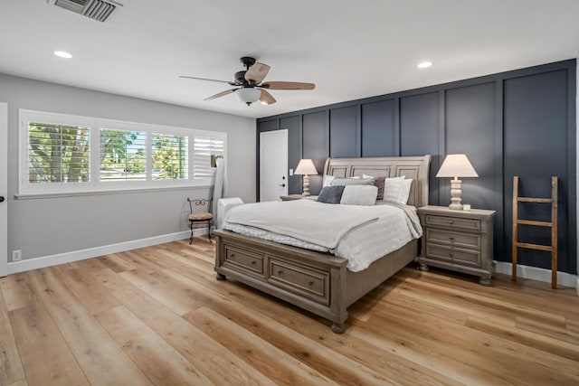 bedroom featuring ceiling fan and light hardwood / wood-style floors