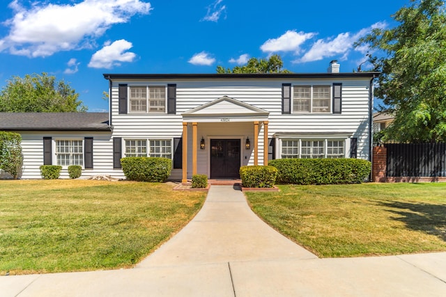 view of front of home with a front lawn