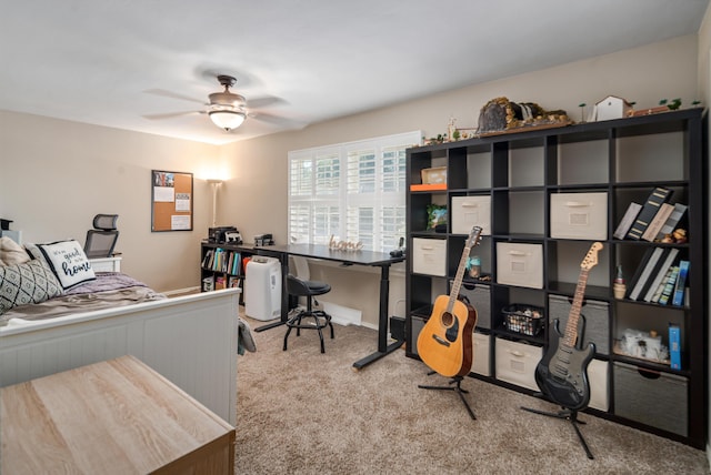 office space with ceiling fan and light carpet