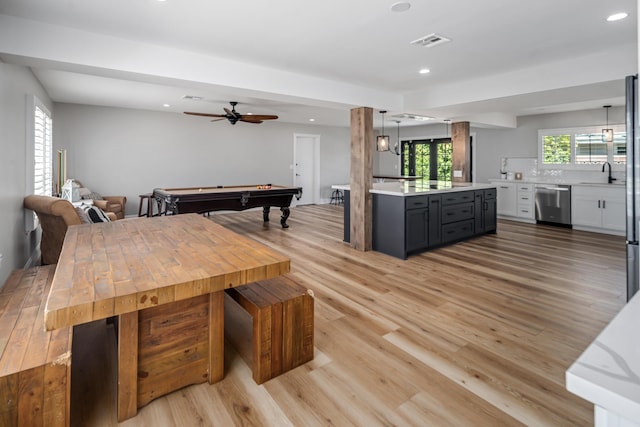 dining room featuring ceiling fan, sink, light wood-type flooring, and pool table