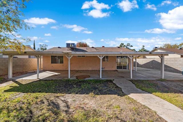 back of property with a patio