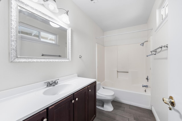 full bathroom featuring shower / bathing tub combination, vanity, and toilet