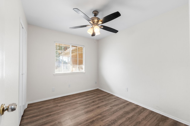 unfurnished room with dark hardwood / wood-style floors and ceiling fan