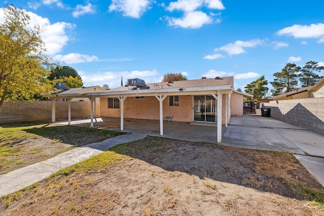 back of property with a patio area