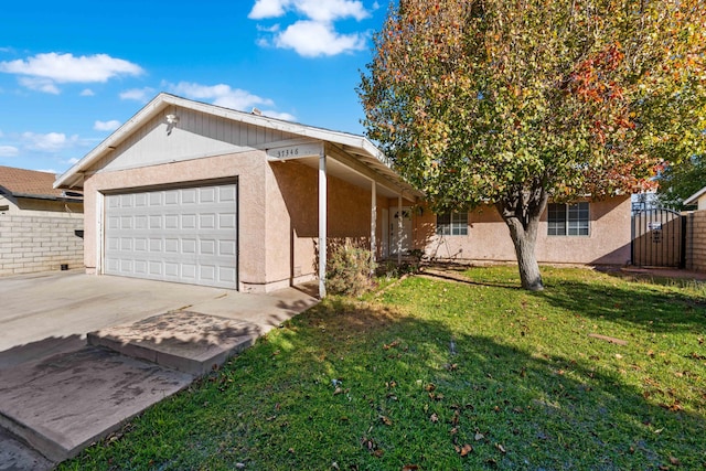 view of side of property featuring a lawn and a garage