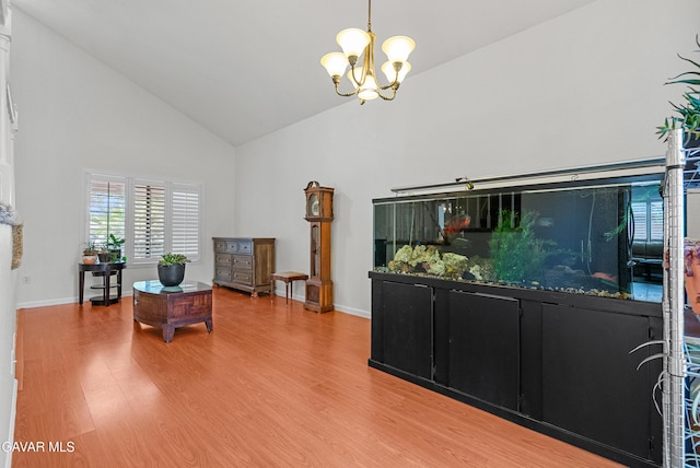 2512 Mildwood Ct, Lancaster, CA 93536 - sitting room featuring high vaulted ceiling, a chandelier, and light wood-style floors