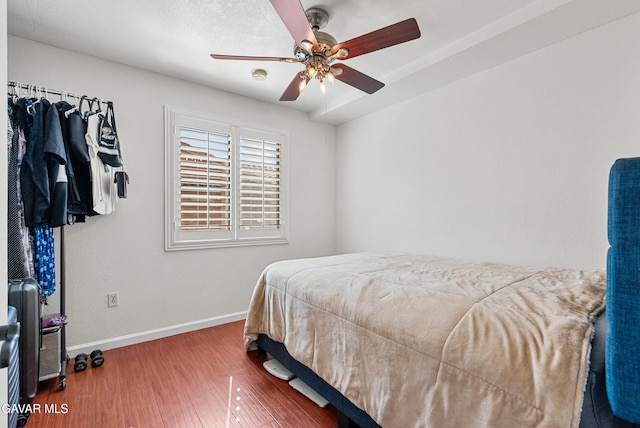2512 Mildwood Ct, Lancaster, CA 93536 - bedroom with wood finished floors and a ceiling fan