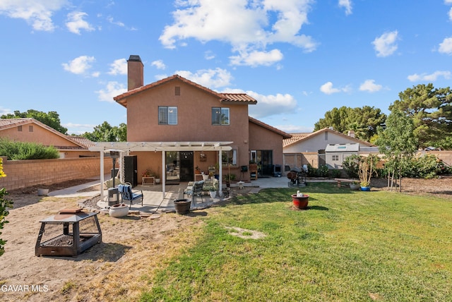 2512 Mildwood Ct, Lancaster, CA 93536 - back of property with a chimney, stucco siding, a pergola, and a fenced backyard