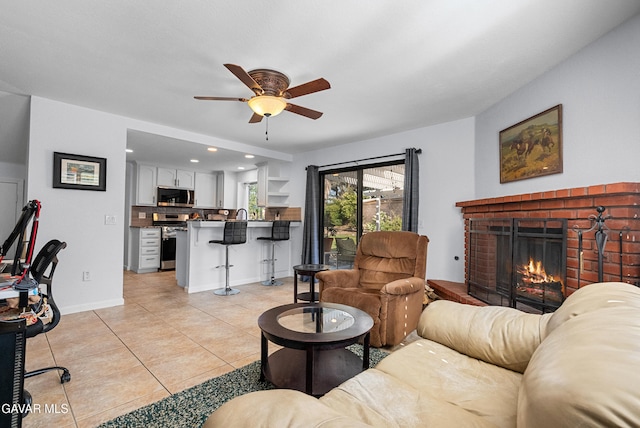 2512 Mildwood Ct, Lancaster, CA 93536 - living room with ceiling fan, a fireplace, light tile patterned floors, and recessed lighting