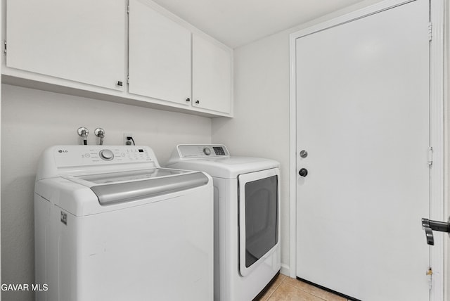 2512 Mildwood Ct, Lancaster, CA 93536 - laundry room with washing machine and dryer, cabinet space, and light tile patterned floors