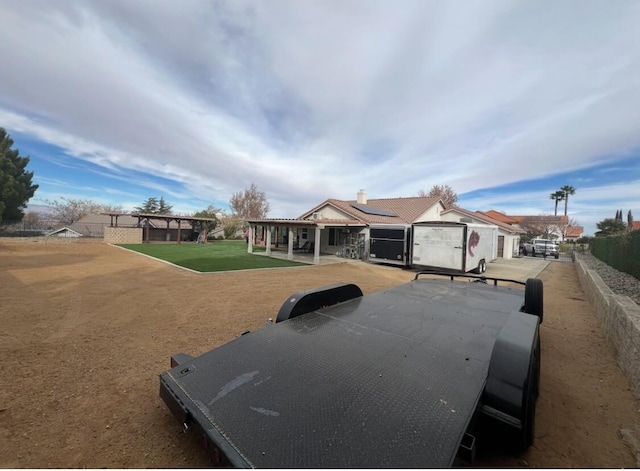 view of front of property with solar panels